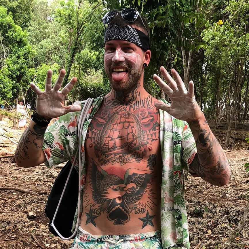 hand and face covered in sunscreen